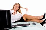 front view of smiling businesswoman showing thumb up in office