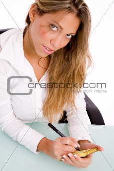 top view of manager writing on paper