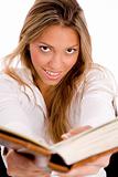 top view of smiling student with book looking at camera