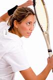side view of young woman ready to play tennis