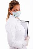 side view of medical professional with writing pad and mask