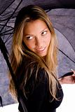 portrait of smiling woman holding umbrella