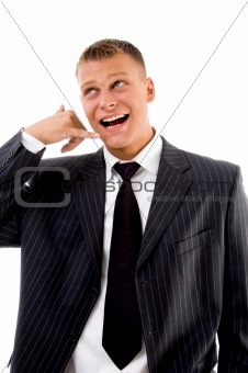smiling executive showing telephonic gesture
