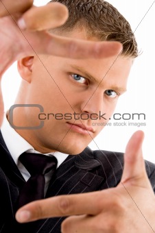 businessman showing framing hand gesture