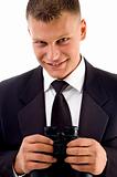 handsome young executive holding binoculars smiling
