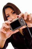 attractive asian woman holding camera