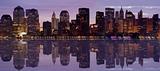 Early Morning Panorama of Lower Manhattan skyline with water reflection
