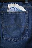 euro banknotes in a jeans pocket