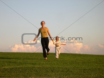 running mother with son clouds