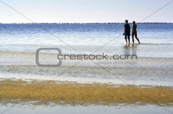 The people go for a walk on the sea