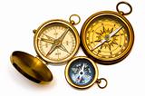 Three old style brass compasses