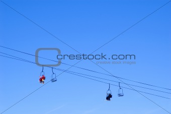 skiers and snowboarders in a chairlift