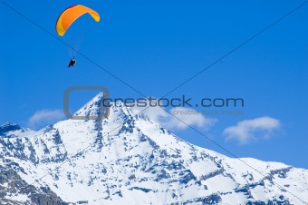 glider above snowed peak