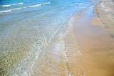 Beach wave sand