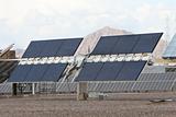 Solar panels in front of desert mountains