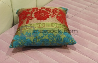 Pillow on a pink matress
