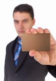 Businessman showing gold card