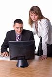 Business couple looking at computer's screen