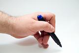 hand with blue pen