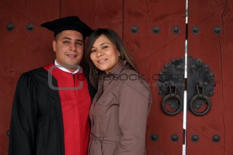 Graduate and his wife on ceremony day.