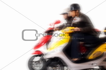 couple girls racing on electric scooter