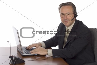 businessman at the desk with headset