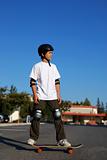 Boy Standing on a Skateboard