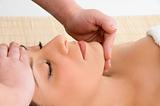 top view of woman taking face massage on an isolated in spa 