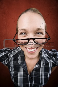 Pretty nerd woman in reading glasses