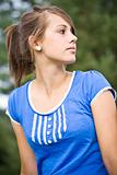 portrait of young girl in blue top