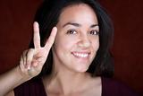 Pretty Young Hispanic Woman Making Peace Sign