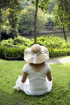 Lady sitting in green park