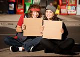Young Man and Woman with Blank Cardboard Signs
