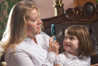 Young Mother and Daughter Enjoying a Personal Moment