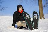 Young woman hiking with Snow shoes / Rackets