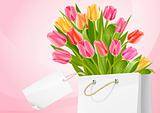 bouquet of tulip flowers in the bag with blank label