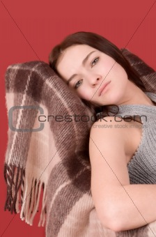 Young woman sitting on armchair