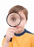 Young boy with magnifying glass 
