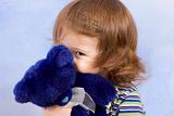 peek-a-boo - child peeking from blue teddy bear