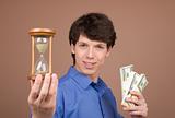 Young businessman with sand-glass and money