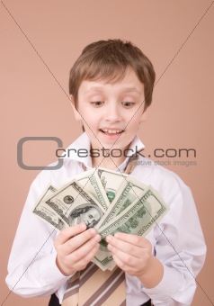Young businessman showing money