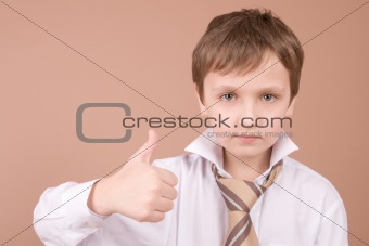 Young businessman giving a thumbs up