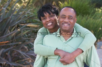 Happy Affectionate Couple posing in the park.