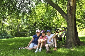 Family resting in a park