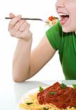 Woman having a bite of pasta