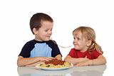 Kids eating pasta
