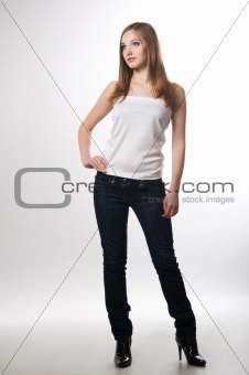 The teenager the girl on a white background