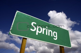 Spring Road Sign with Dramatic Clouds and Sky