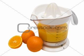 juice extractor and ripe oranges