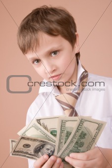 Young businessman showing money